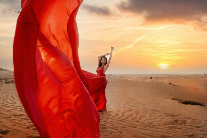 Create unforgettable memories against the stunning backdrop of Dubai's desert sunset where every pose captures the magic of your journey through this iconic landscape.